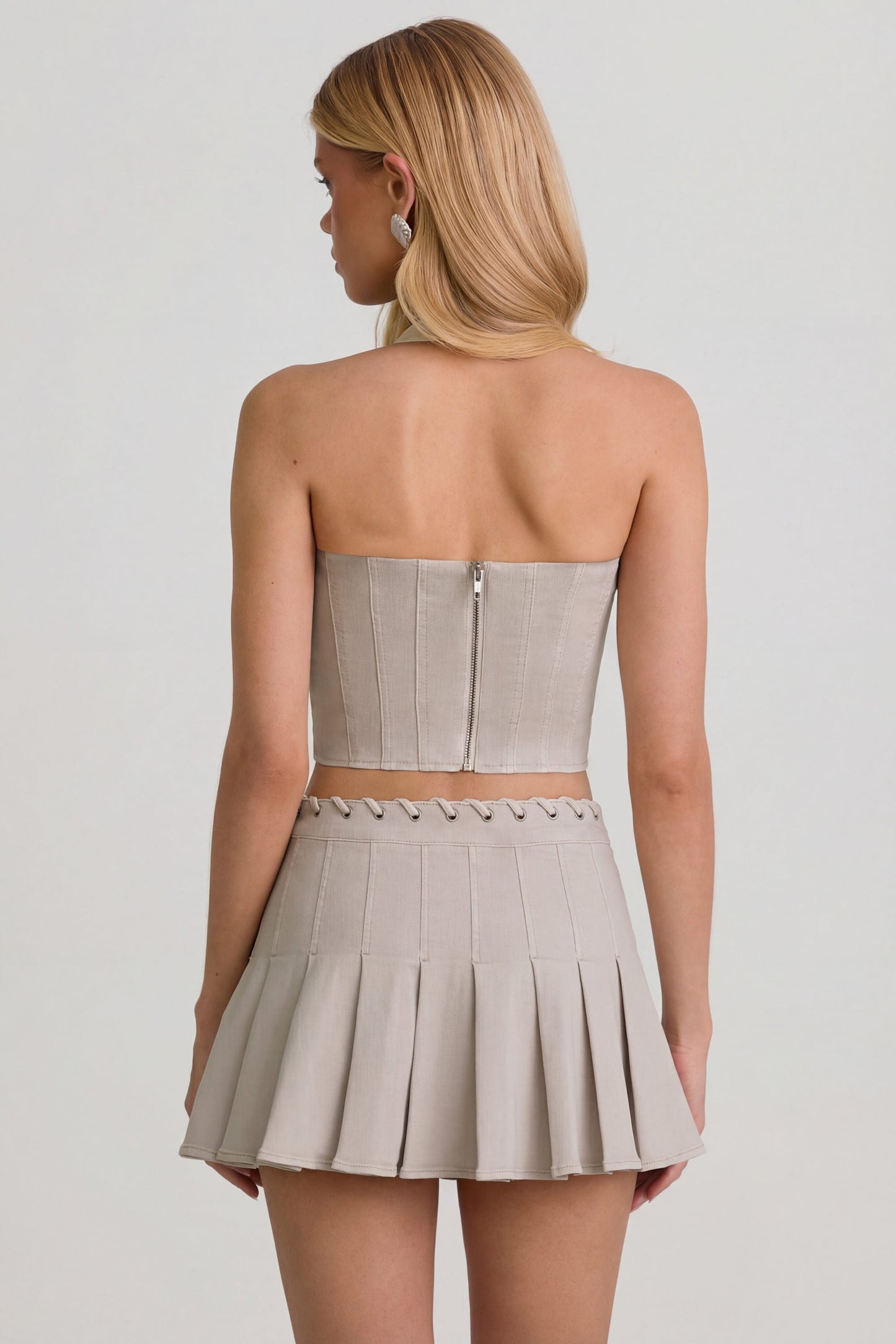 Low-Rise Pleated Mini Skirt in Ecru